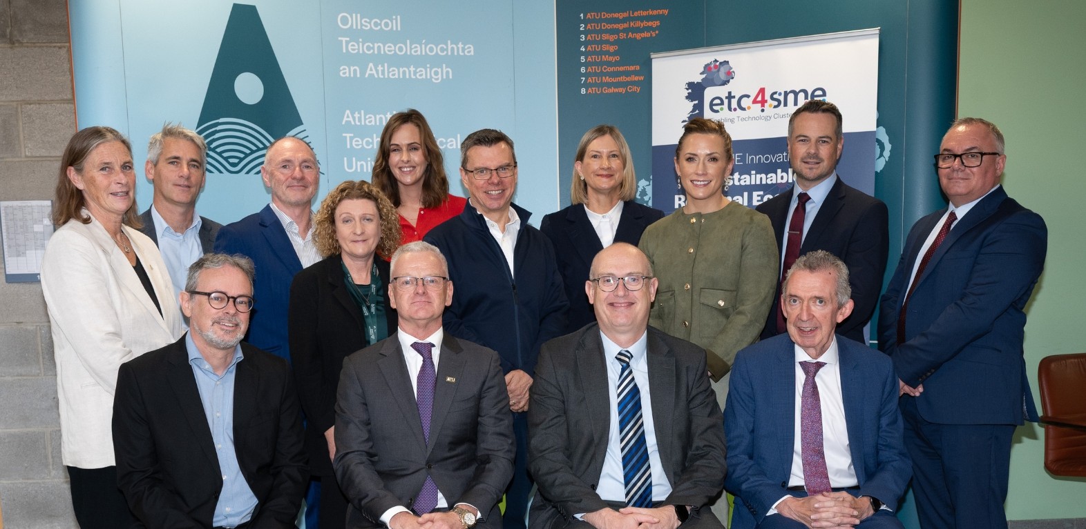 Group of people sitting and standing